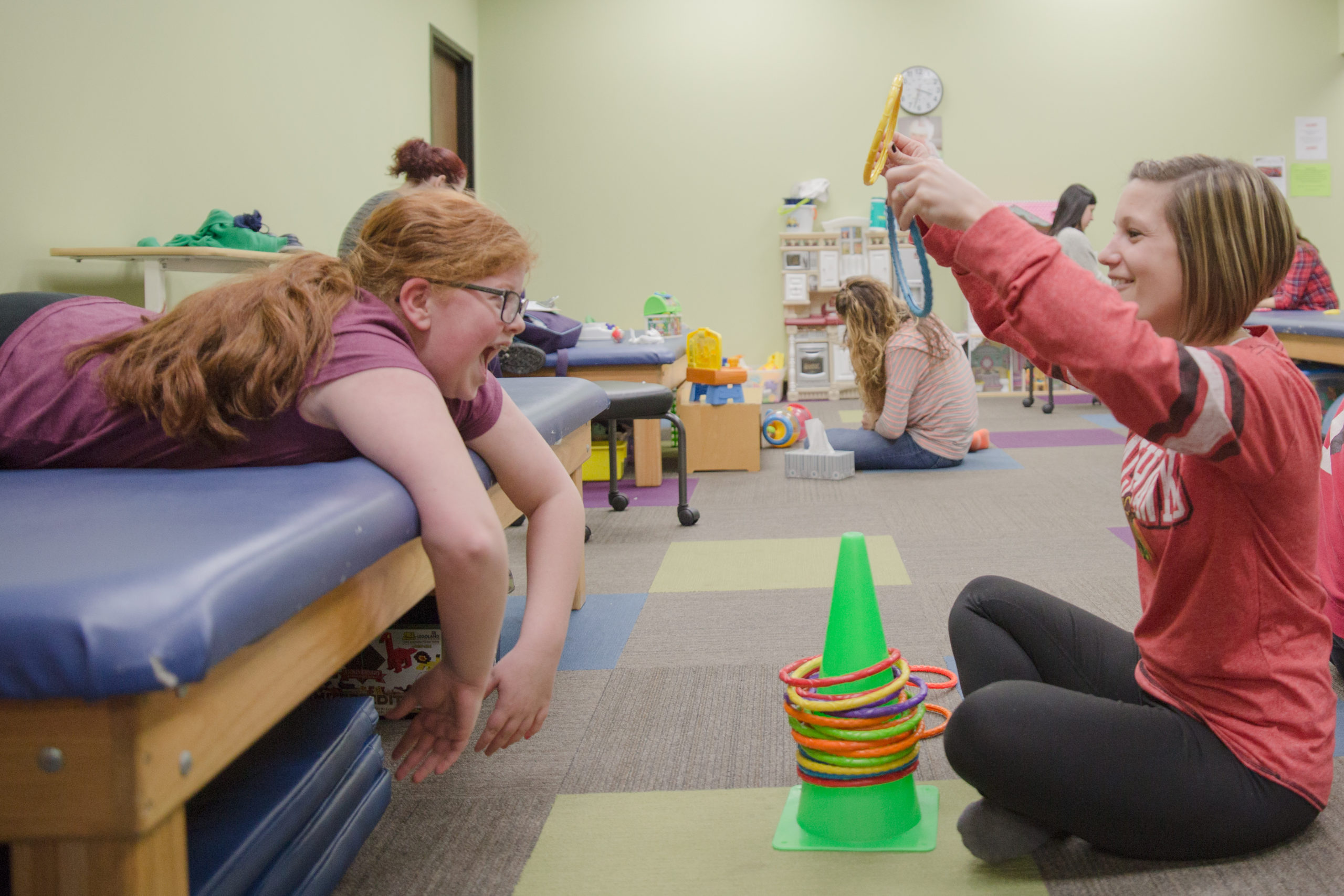 Picture of a physical therapy professional working with a child in one of many Illinois clinics. 
