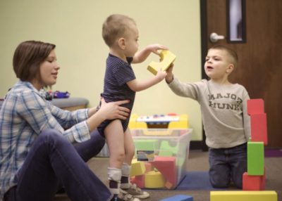 picture of children interacting with the therapist during a RISE therapy program session at Westside in Illinois