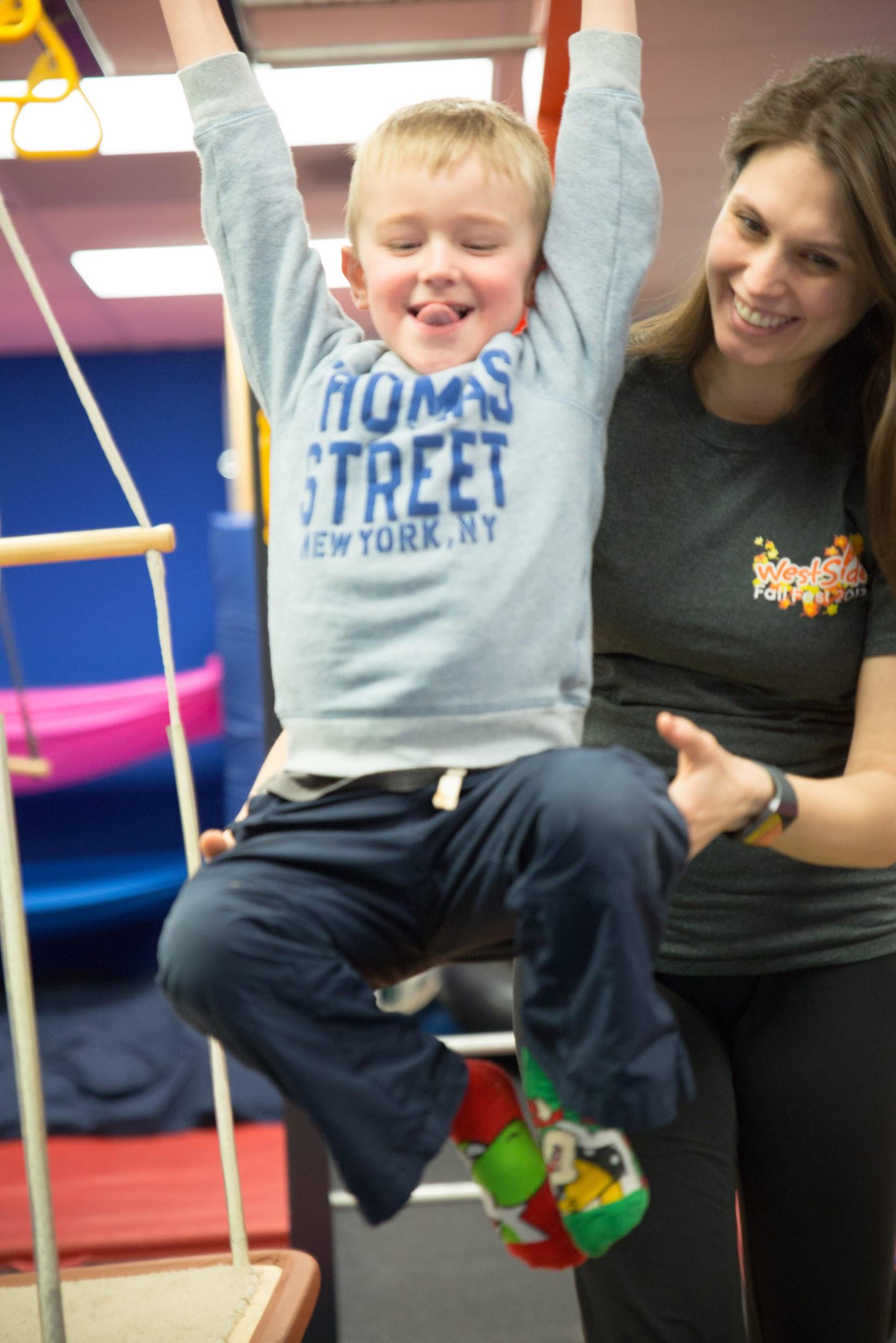 picture of a boy and his therapist during a play-engage-learn IGNITE session at Westside Children's Therapy in Illinois, an ABA Therapy based day program