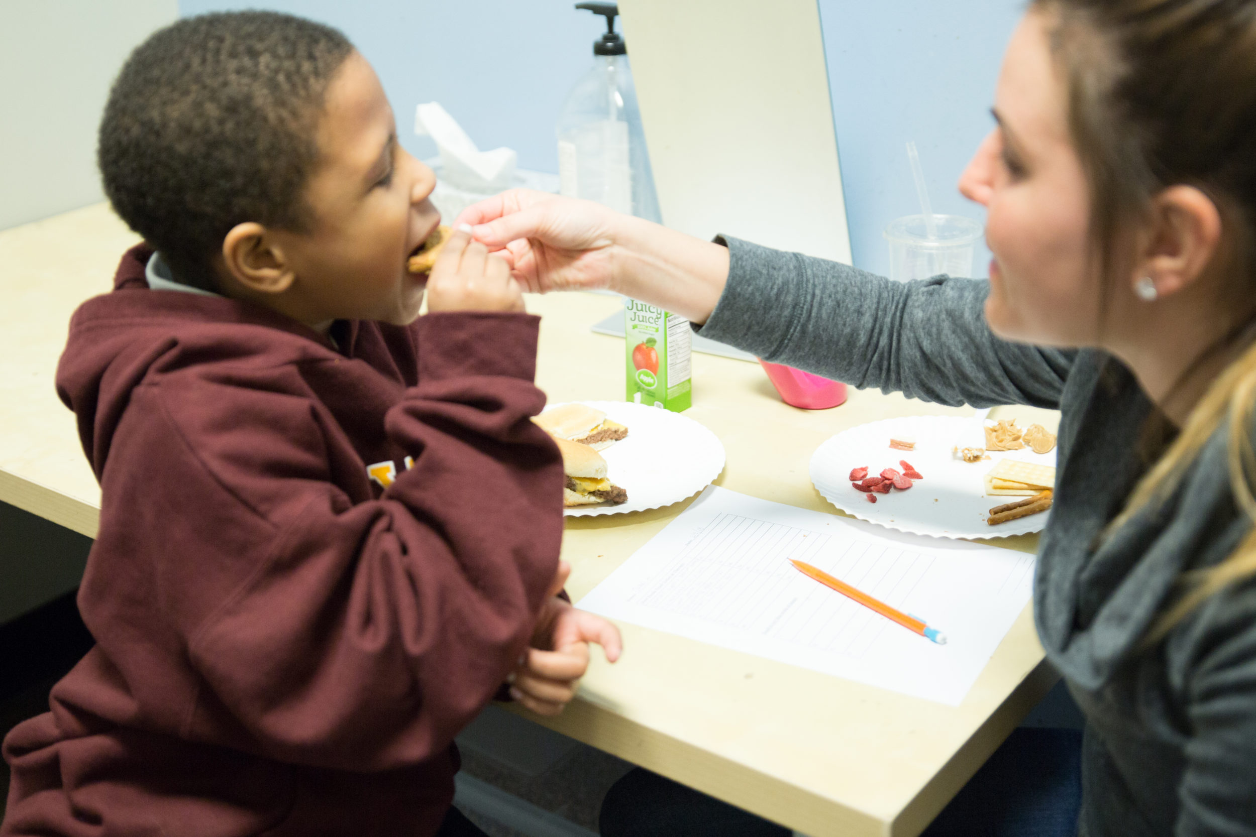 picture of a therapist during a pediatric feeding therapy session with a child at Westside in Illinois