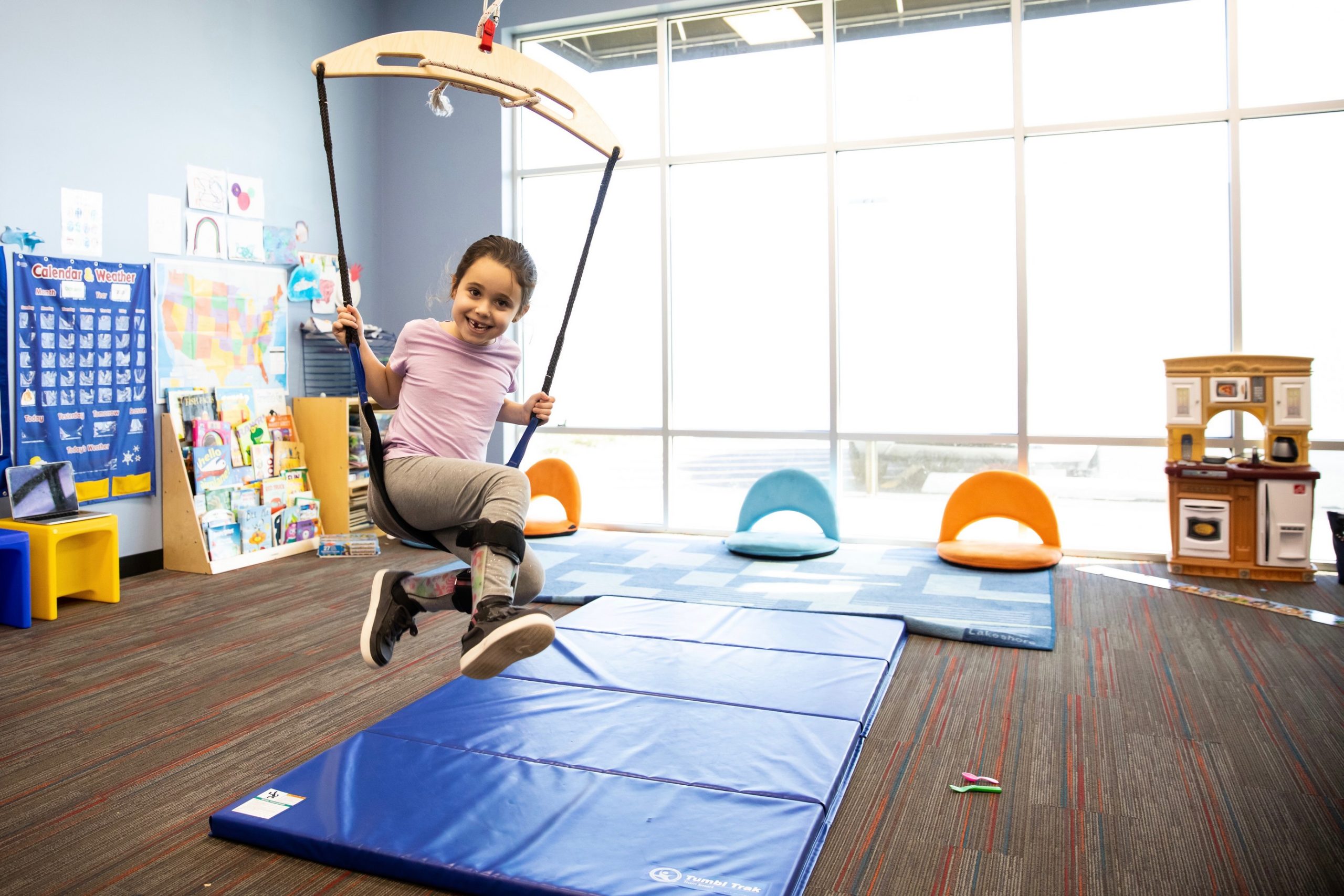 image of a child on a swing at a Westside children's therapy clinic. This photo is used for the Elmhurst Clinic page.