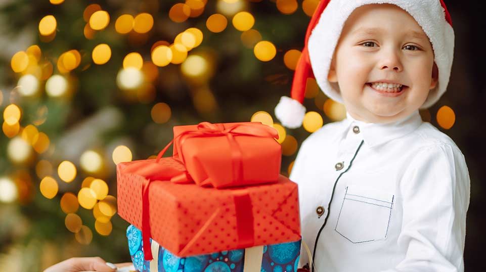 Autistic child getting special sensory gifts during the holiday