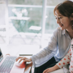 Mother and daughter meeting with a clinician on a laptop during a virtual autism evaluation