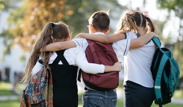 School,Friends,A,Boy,And,Two,Girls,With,School,Backpacks